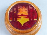an image of a wooden box with a painting on it