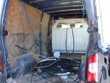 the back of a van with a bunch of wires in the back