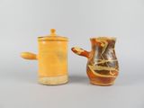 two vases sitting next to each other on a table