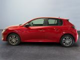 the red toyota corolla is parked in a room
