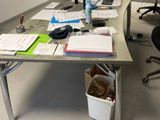 an image of a desk with a lot of papers on it