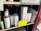 a shelf with a lot of skin care products on it