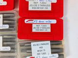many different types of screws in a red box