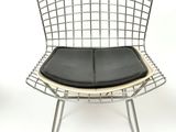 a black chair with a black cushion on it