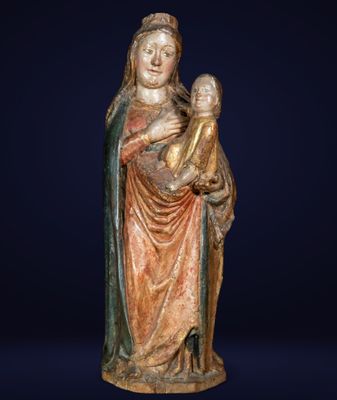 a statue of a woman holding a child in her arms