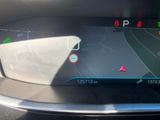 a picture of a car ' s dashboard with a gps device on it