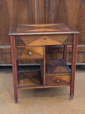 a small wooden table with two drawers on top of it