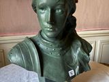 statue of a woman with a crown on her head on a table