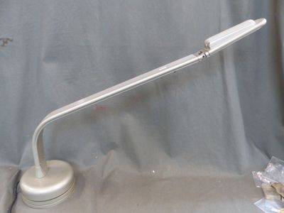 a lamp that is sitting on a table next to a bag of cookies