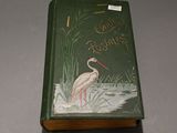 a green book with a picture of a bird on it