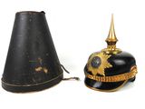 pair of black and gold helmets with gold decorations on them