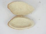 two pieces of bread that are sitting on a white surface