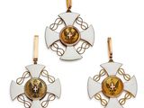an image of a pair of gold and white enamel earrings