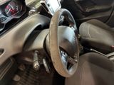 a steering wheel and dashboard of a car in a car showroom