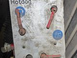 a close up of a metal box with red handles