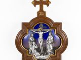 a wooden cross with a picture of jesus on the cross