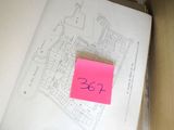 a pink post - it note in a box with a map on it