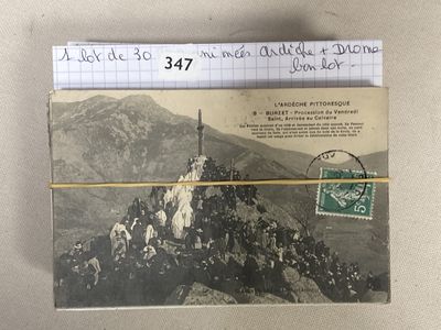 a postcard with a picture of a group of people on top of a mountain