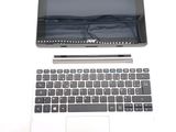 a laptop computer sitting next to a tablet computer