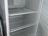 a white refrigerator that is open in a kitchen