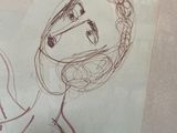 a picture of a drawing of a woman on a piece of paper