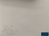 a picture of a clock on a wall with writing on it