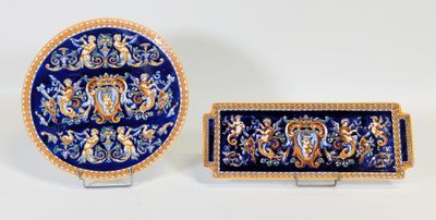deux pièces en métal plaqué bleu et or ornées d'un lion