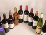 bottles of wine are arranged in a circle on a white surface