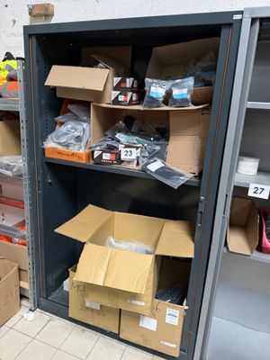 many boxes and boxes on the shelves in the room