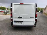 a white van that is parked on the side of the road