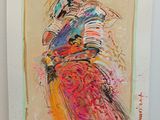 un tableau représentant une femme en robe colorée accroché au mur