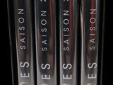 four dvds in a box on a black background