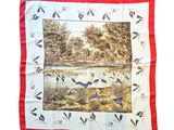 a red and white scarf with a picture of birds on it
