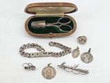 a box with a bunch of silver items inside of it