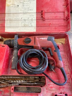 a red tool box with a hammer and other tools in it
