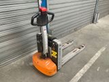 a forklift that is parked in front of a garage door