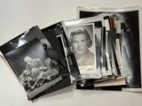 a pile of old photos and a picture of a woman