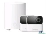 the two cameras are next to each other on a white surface