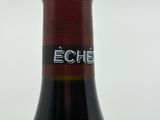 a bottle of wine that is sitting on a table