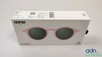 the box of a pair of sunglasses is sitting on the table