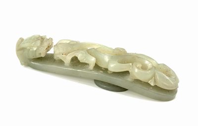a white jade hair clip with flowers on it