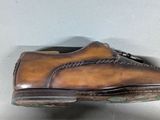 a pair of shoes that are on a white surface