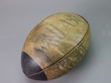 an old football that is sitting on a table