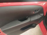 the door handle of a red car with the door open