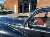a black car that is parked in front of a building