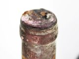 a close up of a bottle of wine with a white background