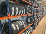 many tires on the shelves in the store