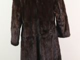 an image of a fur coat on a mannequin stand
