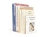 three books are stacked on top of each other on a white surface
