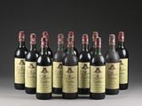 six bottles of wine lined up in a row on a table
